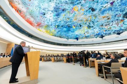 Secretary-General António Guterres (left at podium) addresses the opening of the 58th session of the Human Rights Council in Geneva.