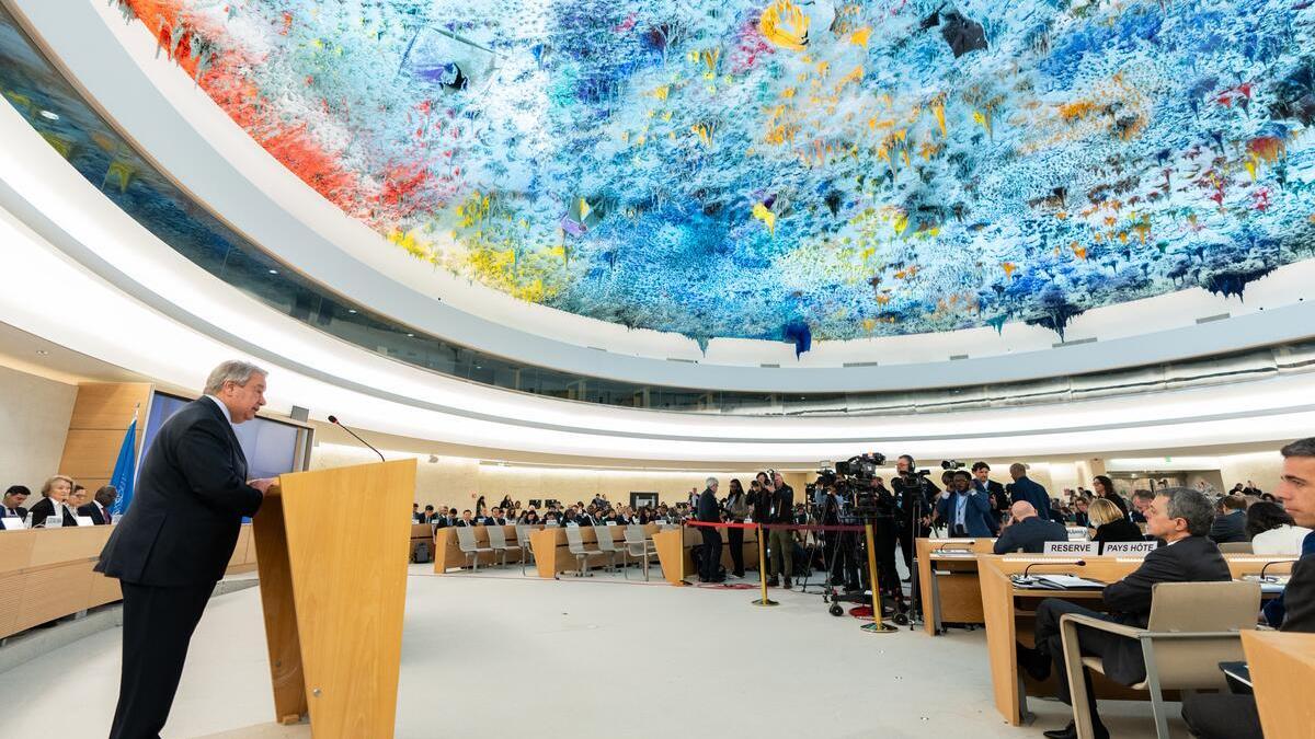 Secretary-General António Guterres (left at podium) addresses the opening of the 58th session of the Human Rights Council in Geneva.