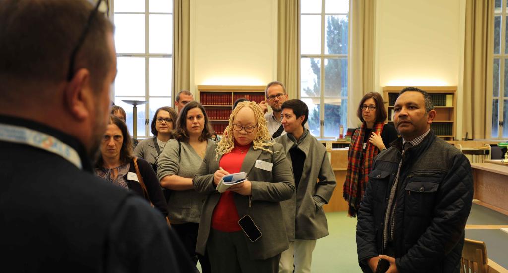 Participants of UN-LINKS 2024 take a tour of the UN Library & Archives Geneva