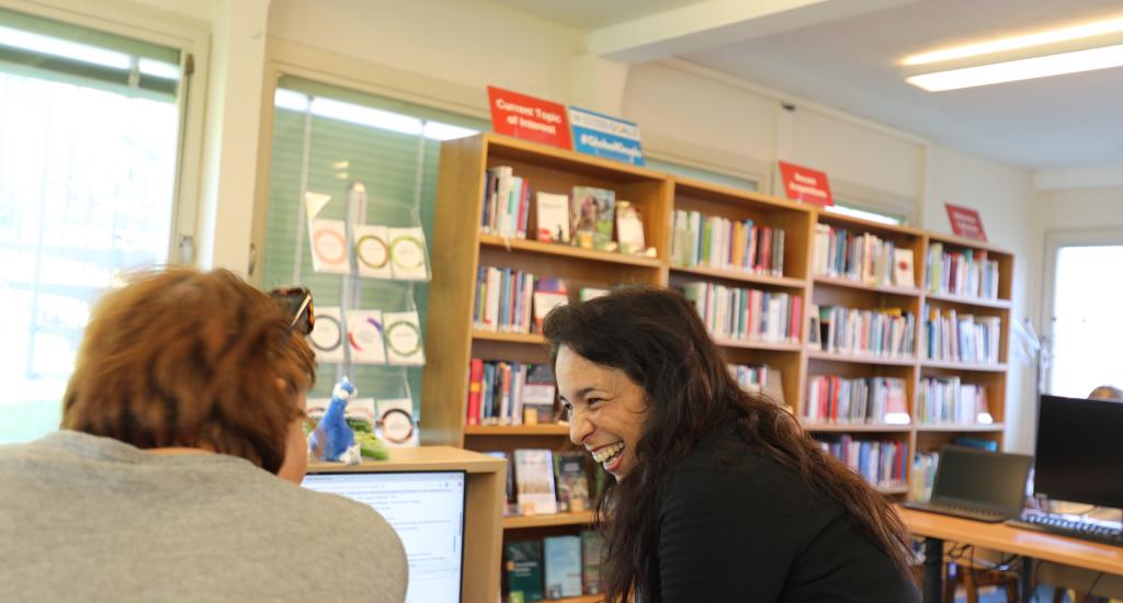 A Library colleague helps a user in the Main Reading Room.