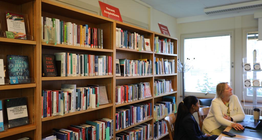 A Library colleague supports a user in the Main Reading Room.