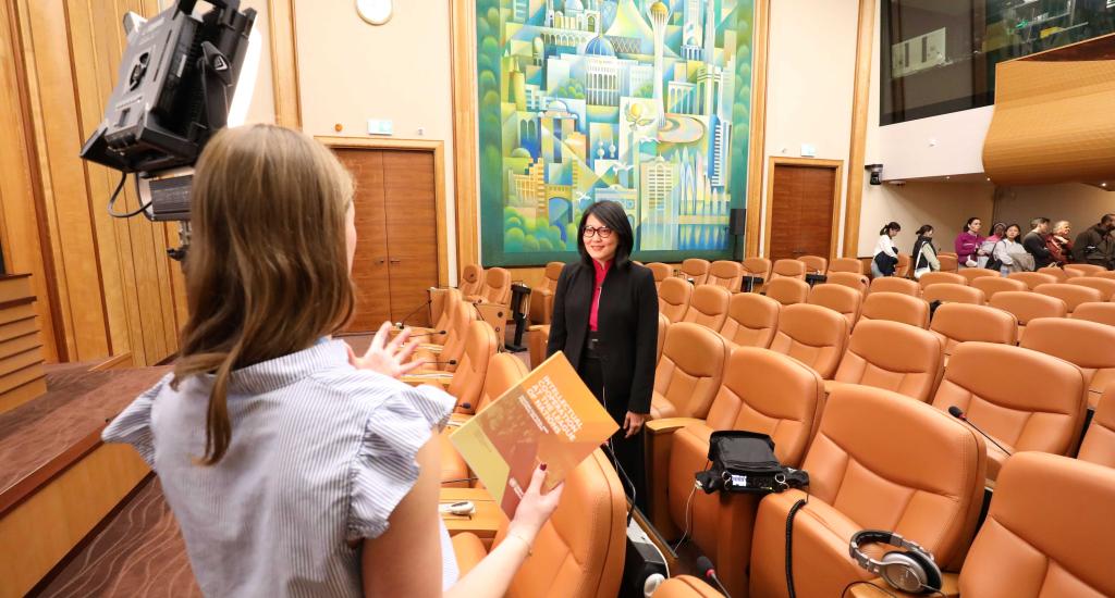 Jennifer Chang, one of the authors of the book Intellectual Cooperation at the League of Nations, records a video interview in Room 14 at the Palais des Nations.