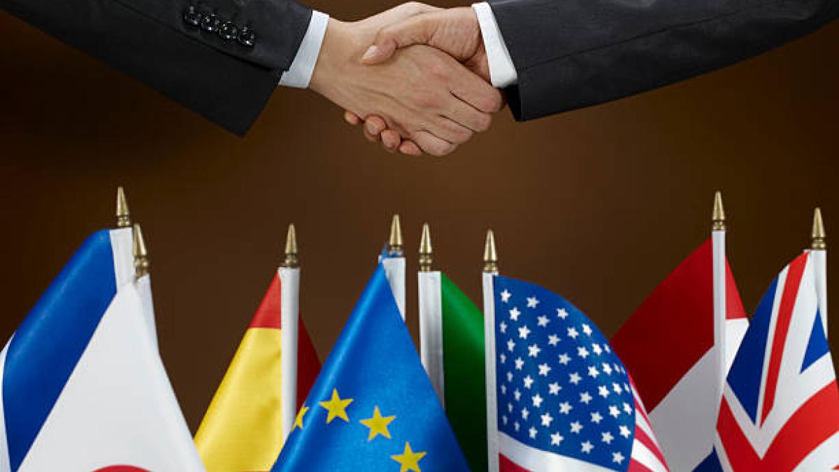 Picture of two individuals shaking hands