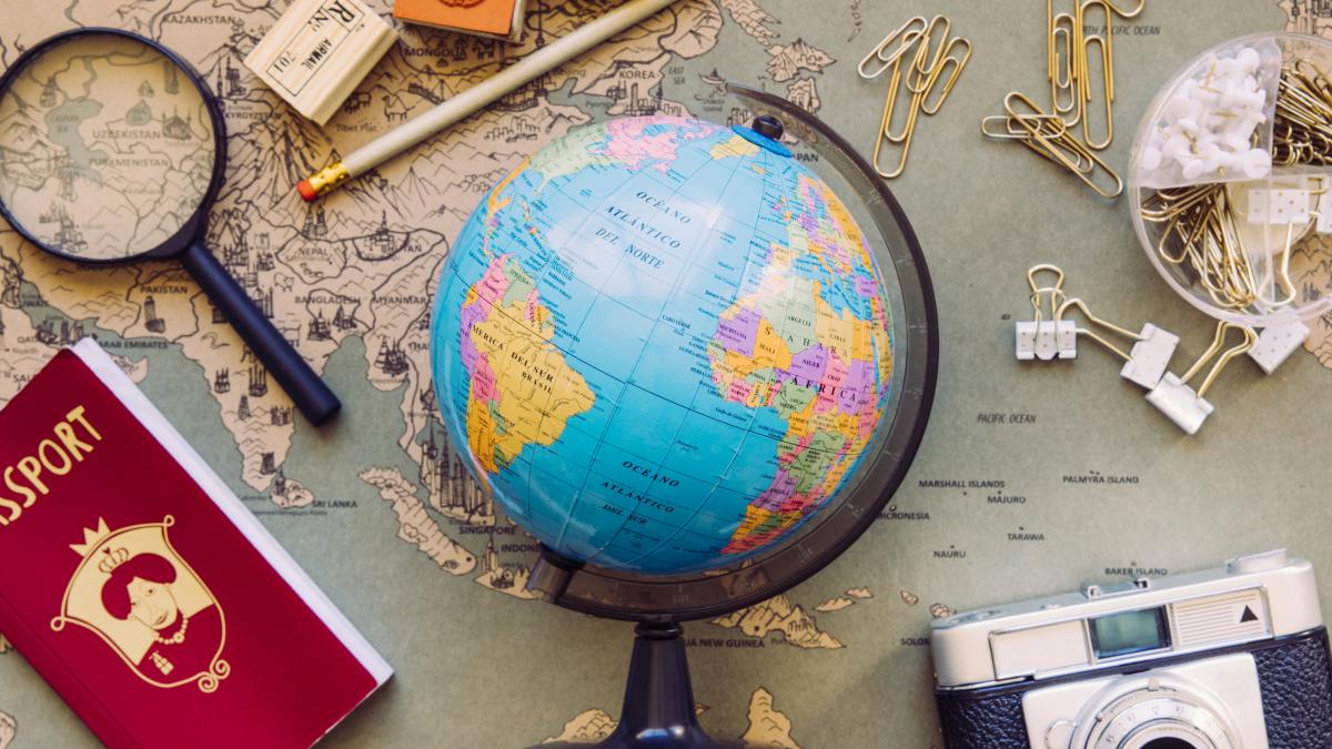 Picture of globe and world map in the background