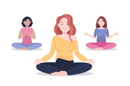 Picture of three woman sitting down crossing their legs meditating