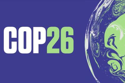 Picture title indicating COP26 in white and green with half a globe in the background