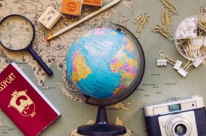 Picture of globe and world map in the background